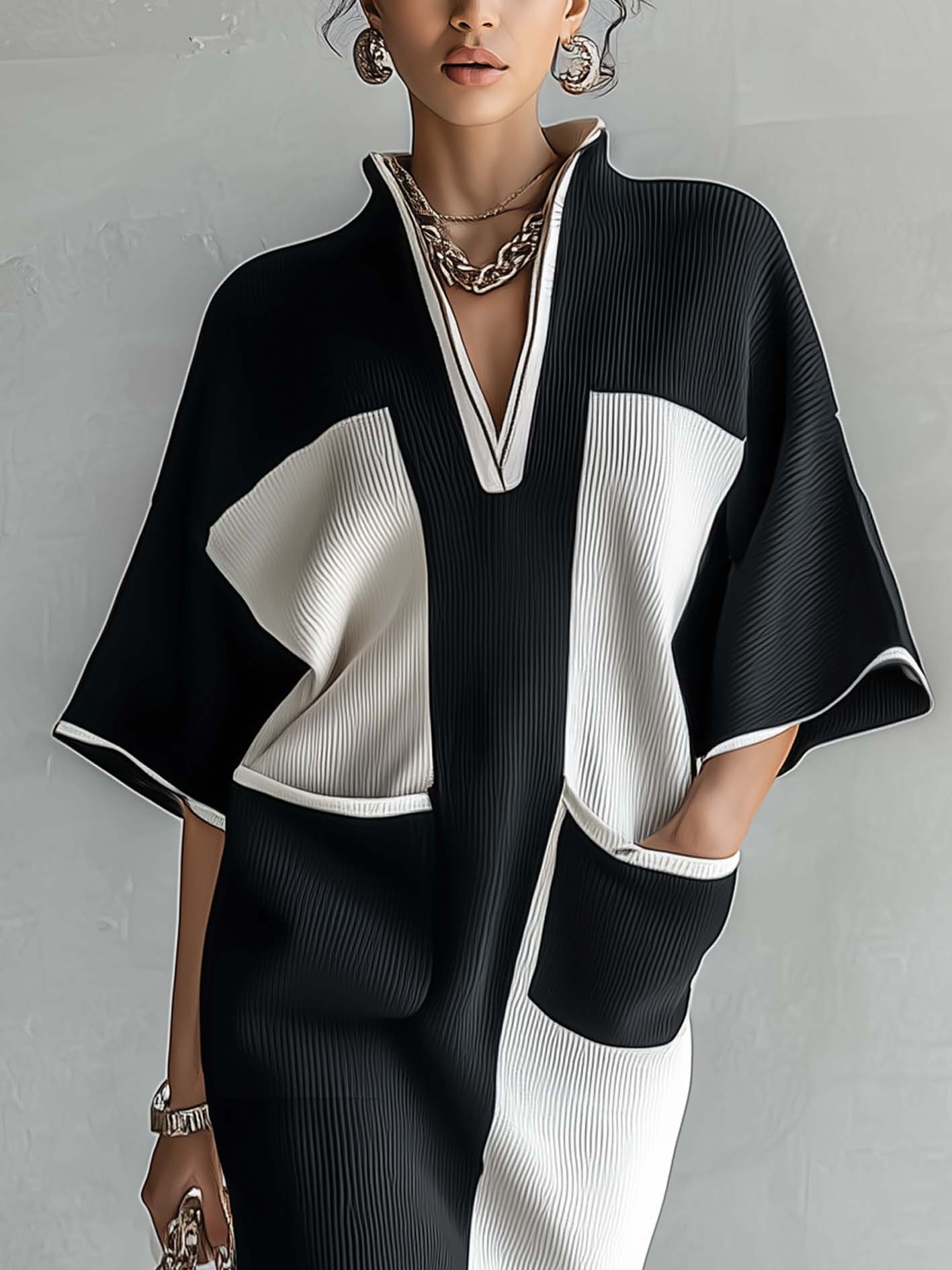 Black and white color-block midi dress with V-neck and contrast sleeve panels, front view