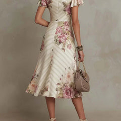 Floral ruched wrap midi dress, cream base with pink rose print and short puff sleeves