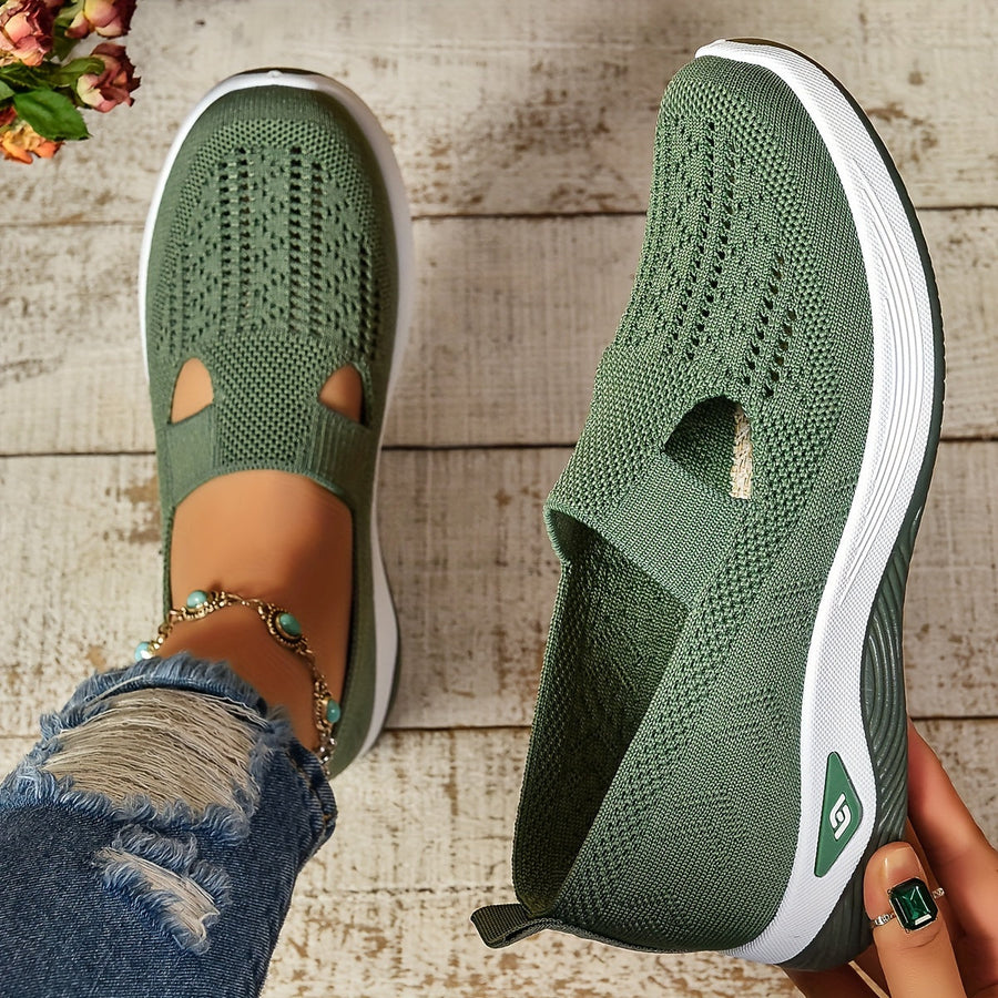Green knit slip-on shoes with side cutouts and white sole