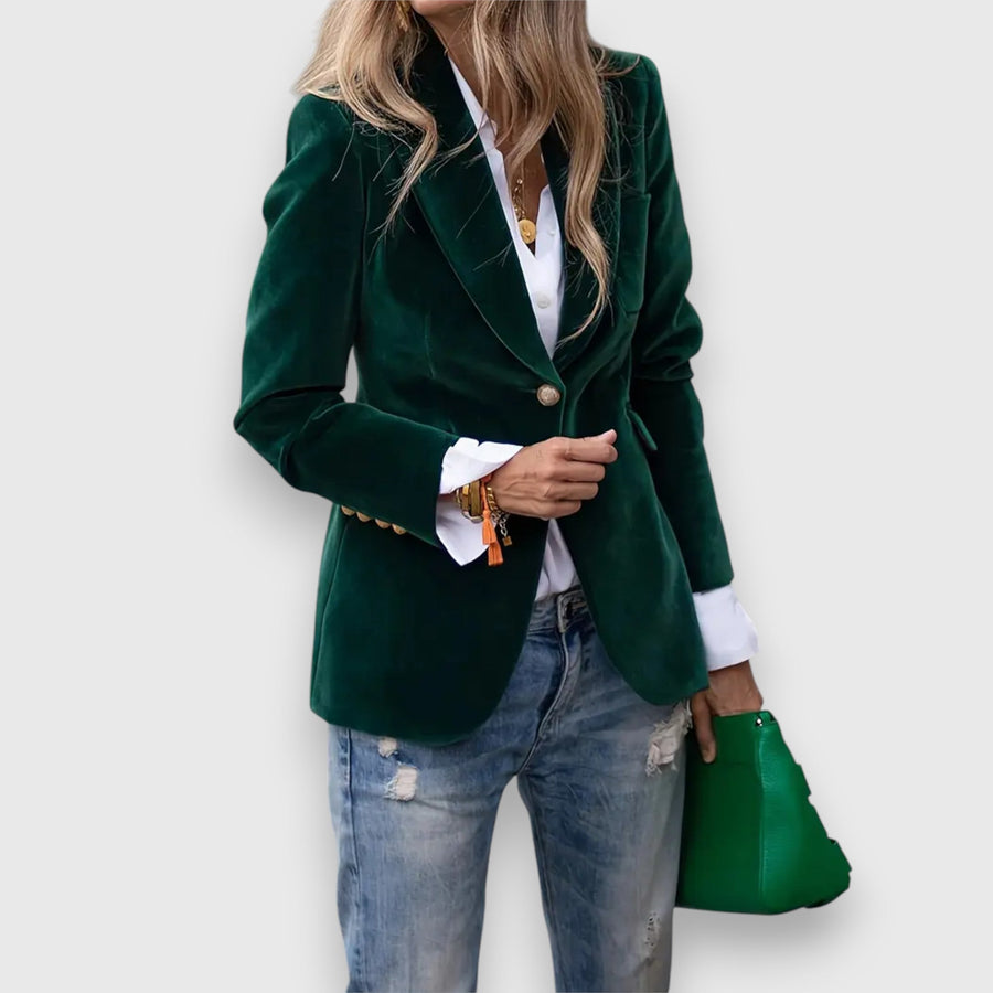 Women’s green blazer with notched lapels, single button, and two front pockets