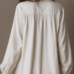 White mini shirt dress back with gathered yoke and long balloon sleeves