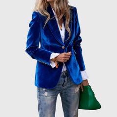 Women’s blue blazer with notched lapels, single button, and two front pockets