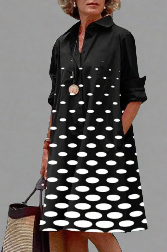 Black relaxed midi dress with white polka dots, collared button-up, long sleeves