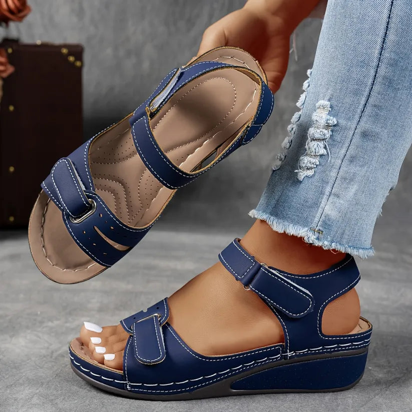 Blue supportive wedge sandals with two buckled straps and open toe