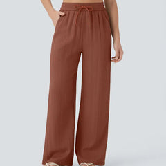 Brown wide-leg trousers with elastic waistband and drawstring ties
