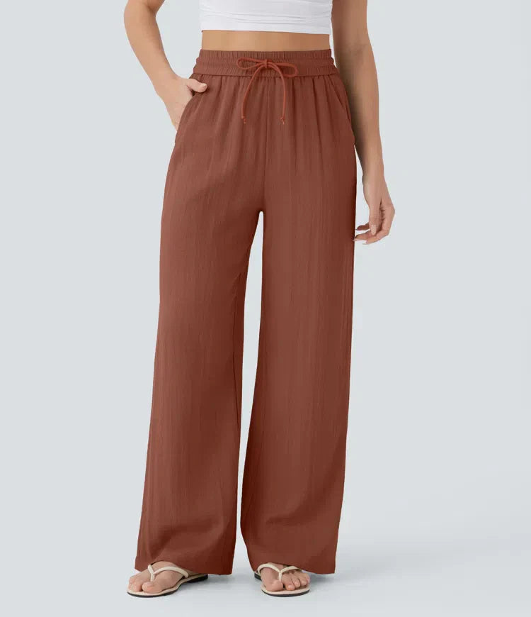 Brown wide-leg trousers with elastic waistband and drawstring ties