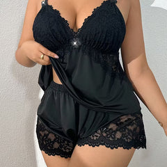 Black lace-trim cami pajama set with lace triangle cups and ruffled shorts