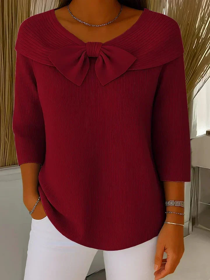 Red sweater with round neckline bow and three-quarter sleeves