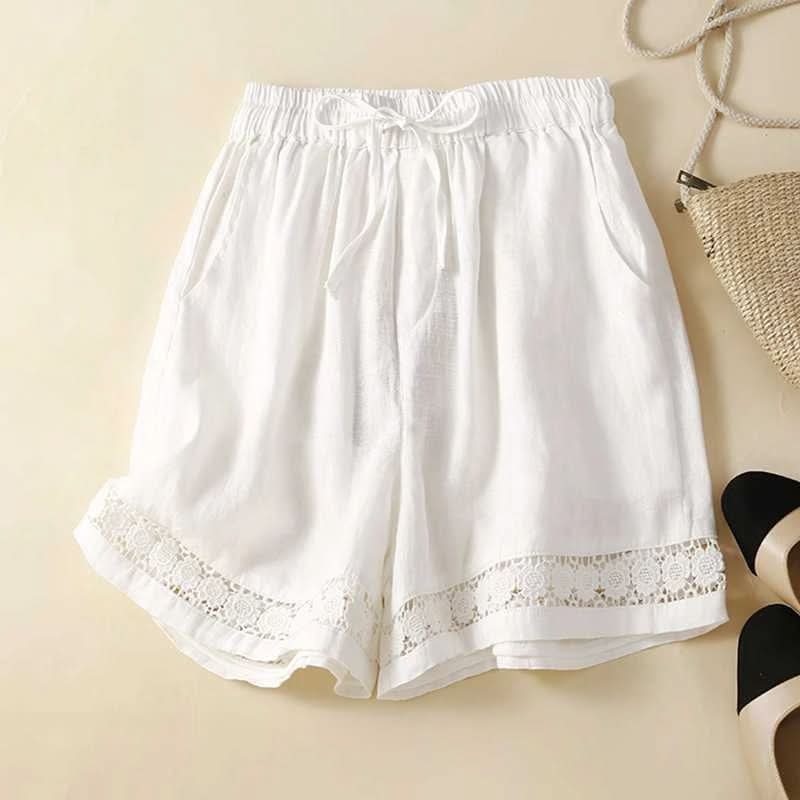 White linen shorts with elastic waist, drawstring tie, and lace-trim hem.