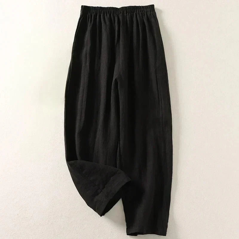 Black lightweight trousers with elastic waistband and relaxed straight leg