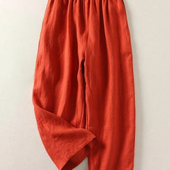 Orange elastic-waist comfortable everyday trousers with loose, tapered legs