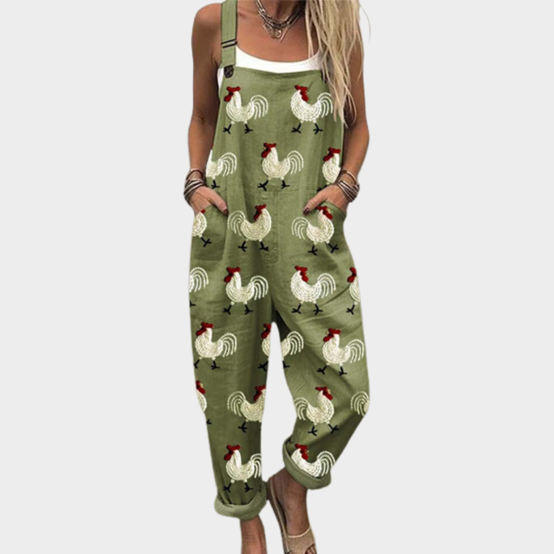 Green printed overalls with rooster and rainbow pattern, sleeveless bib-front design
