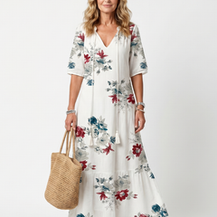 White floral tie-neck midi dress, short sleeves and tiered skirt.