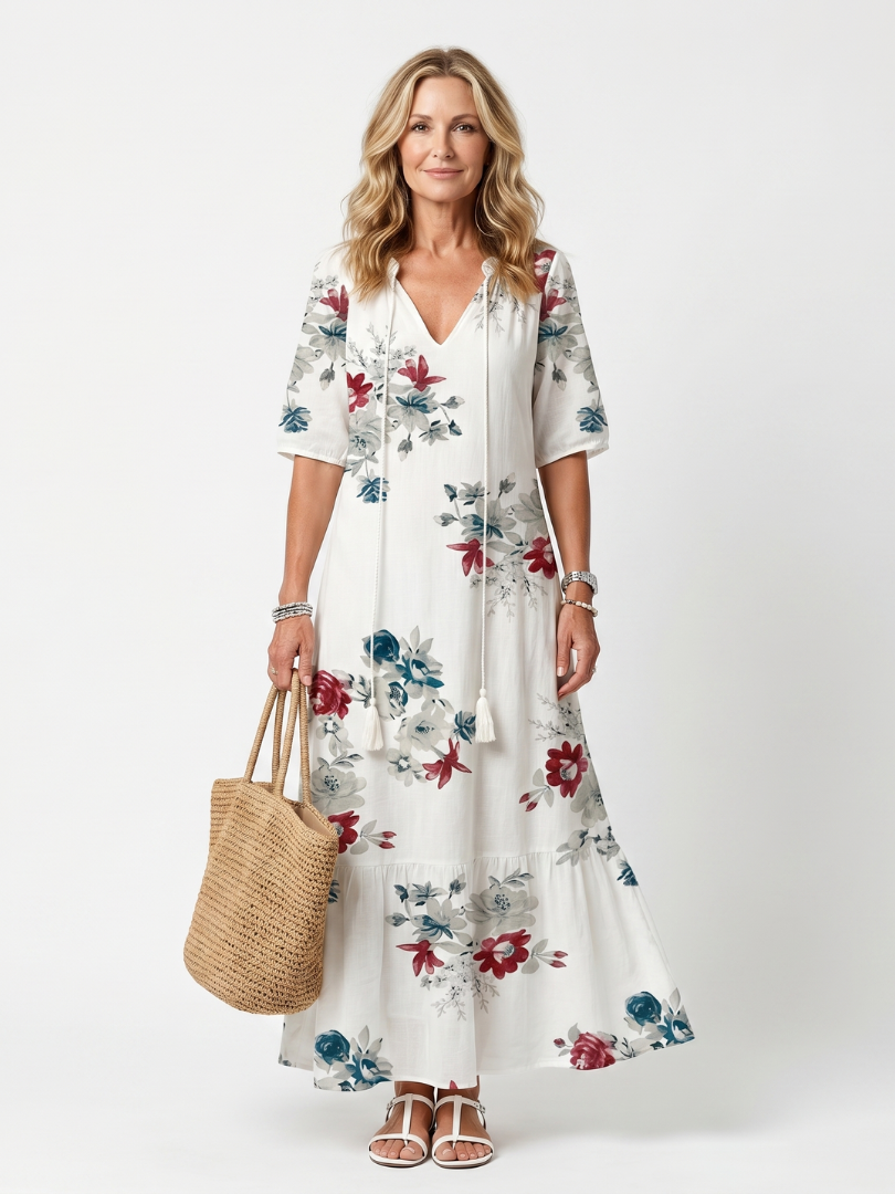 White floral tie-neck midi dress, short sleeves and tiered skirt.