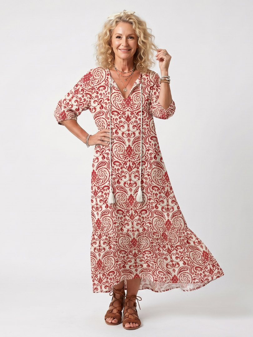 Red paisley tie-neck midi dress with 3/4 sleeves, V neckline, and flared skirt
