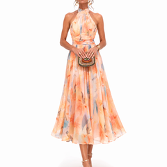 Halter watercolor maxi dress in orange and blue floral print, fitted bodice and full skirt