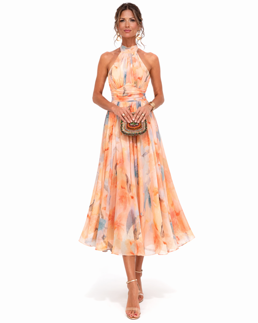 Halter watercolor maxi dress in orange and blue floral print, fitted bodice and full skirt