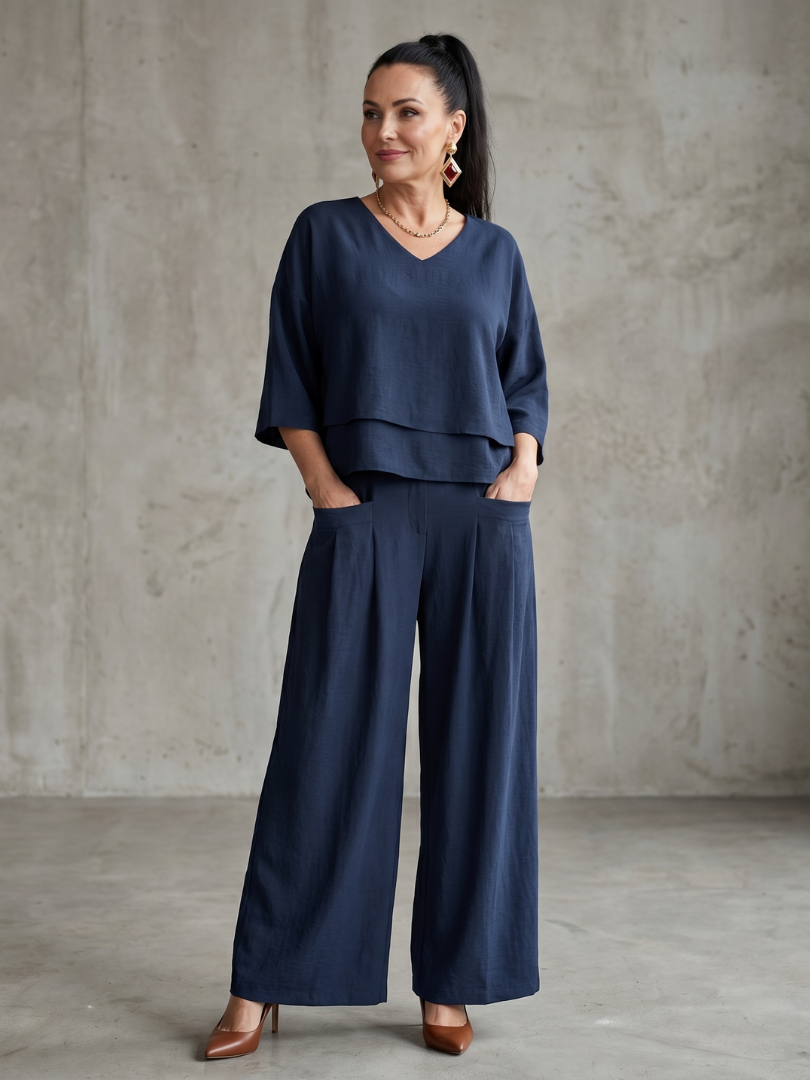 Navy layered V-neck top with wide-leg pants set, full-length front view