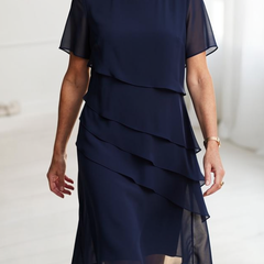 Dark navy ruffle dress with layered tiers, short sleeves, chiffon look, knee length