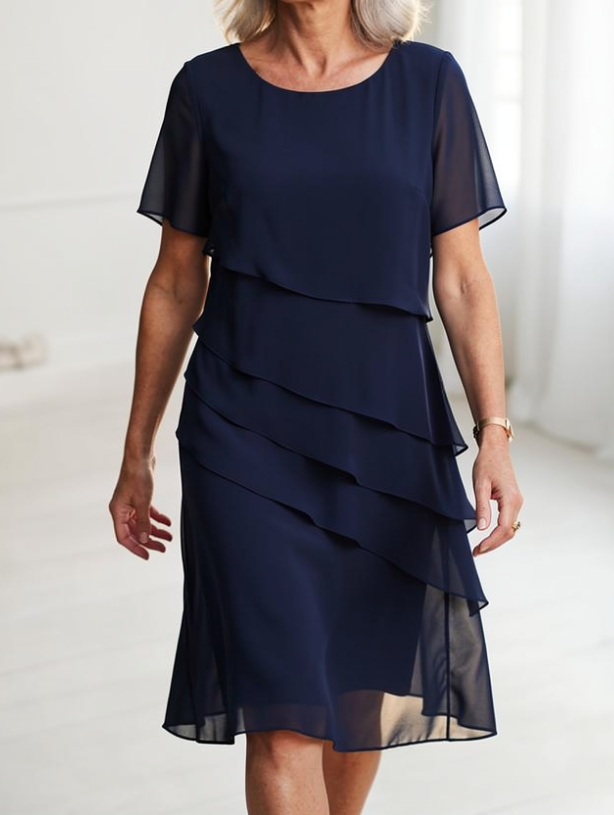 Dark navy ruffle dress with layered tiers, short sleeves, chiffon look, knee length
