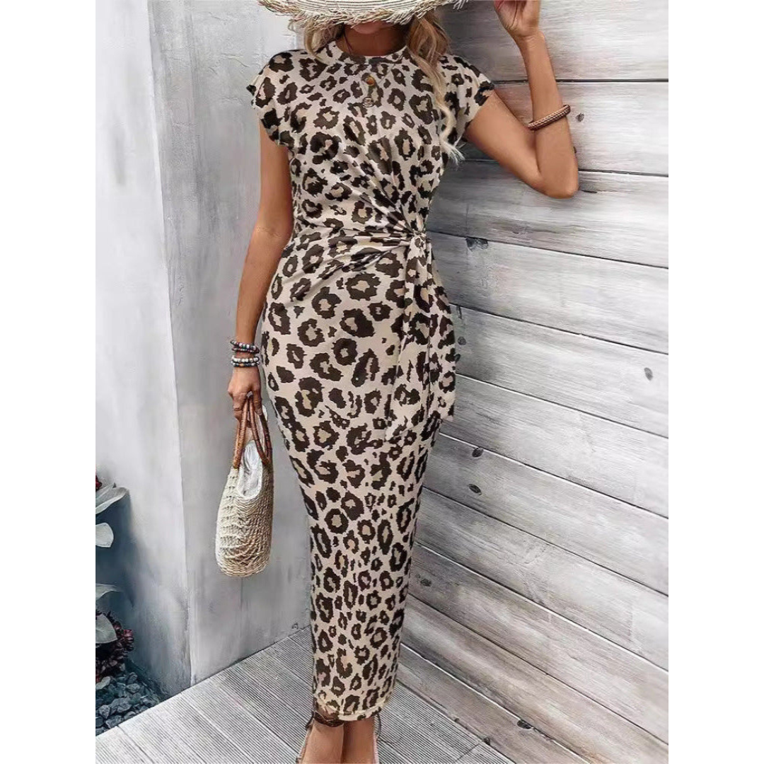 Leopard print bodycon midi dress with crew neck flutter sleeves, tan with black spots.