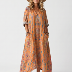 Orange printed midi dress with pockets, loose fit, and short sleeves