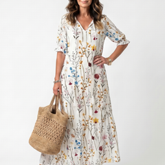 White botanical print midi dress with tie-neck and short puff sleeves, button front