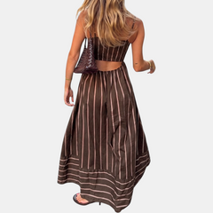 Brown striped maxi dress with thin straps, backless cutout, and gathered full skirt