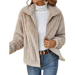 Beige zip-up teddy fleece jacket with raised collar and full front zipper.