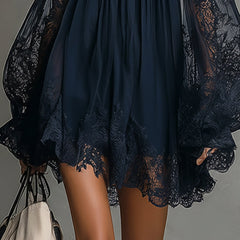 Navy tiered mini dress with lace-trim hem and lace sheer sleeves, off-shoulder style.