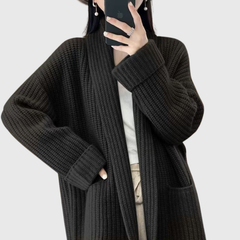 Black chunky knit cardigan with shawl collar and patch pockets