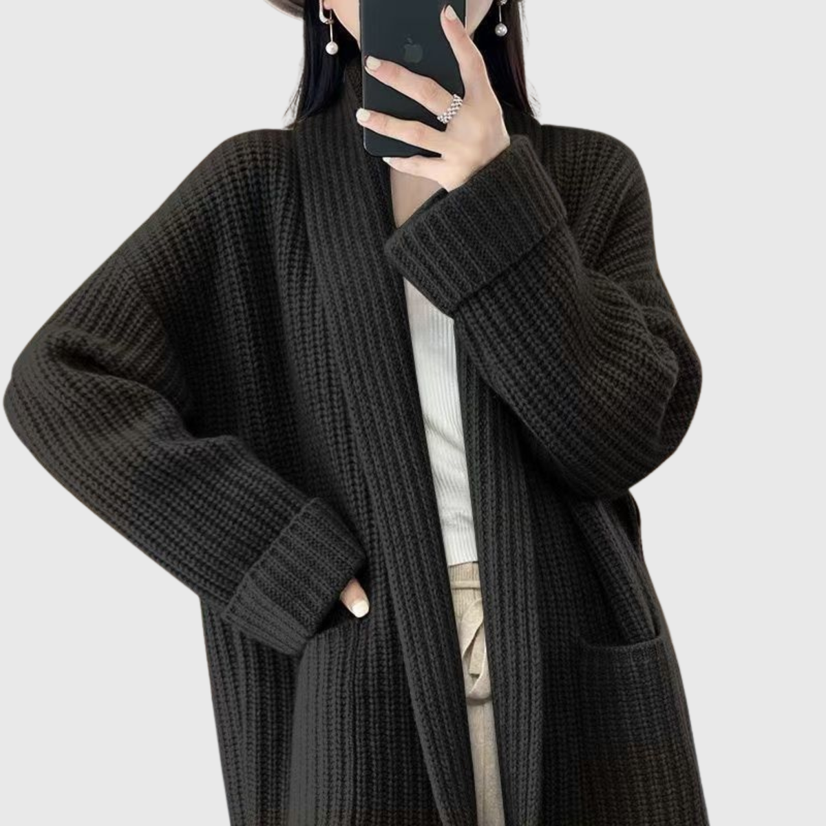 Black chunky knit cardigan with shawl collar and patch pockets