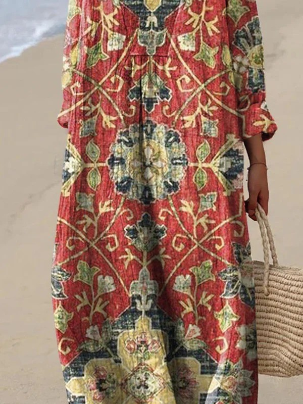 Boho maxi dress, V-neck and long sleeves, red-green floral pattern close-up midsection