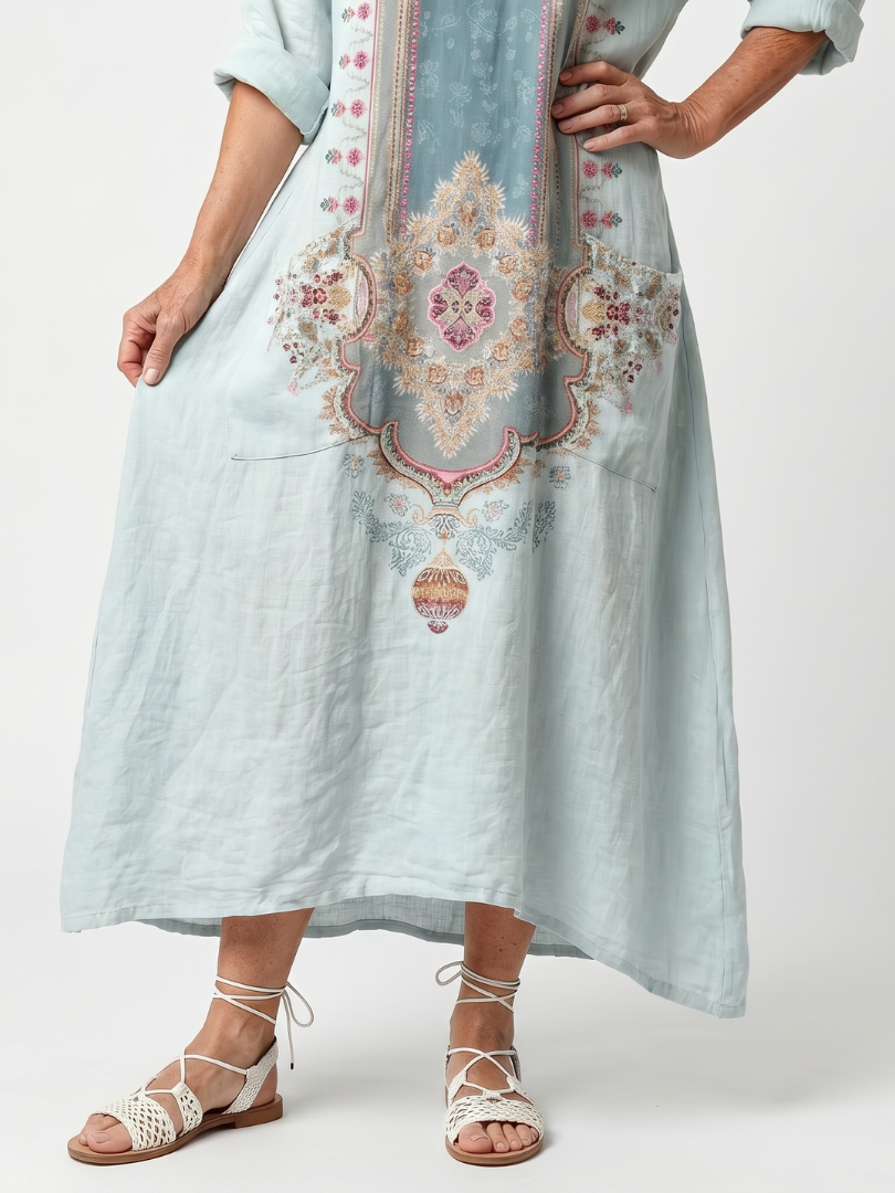 Sky blue pocket midi dress with ornate front embroidery and side pockets, front view