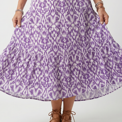 Purple printed midi dress with tiered hem and gathered skirt detail