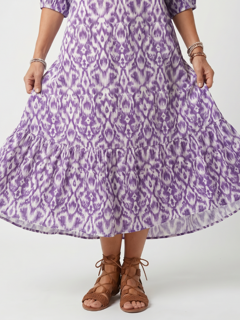Purple printed midi dress with tiered hem and gathered skirt detail