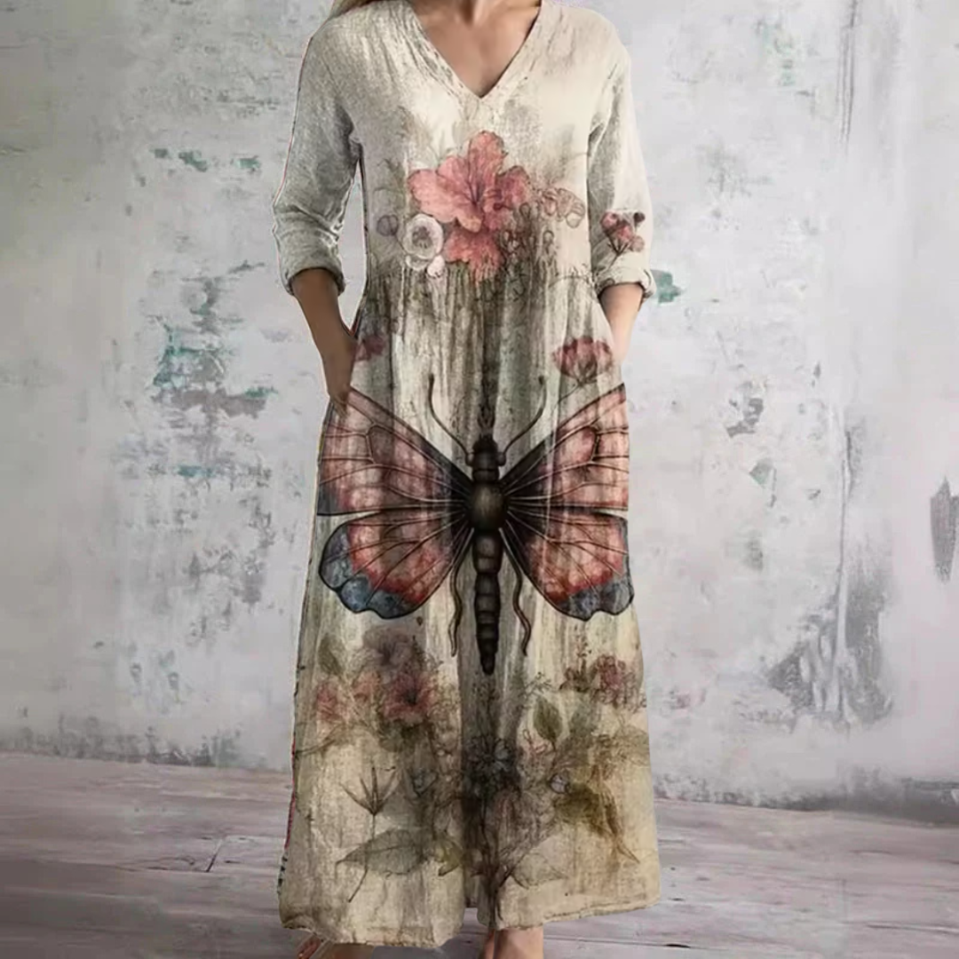 Beige V-neck floral maxi dress with butterfly graphic and three-quarter sleeves