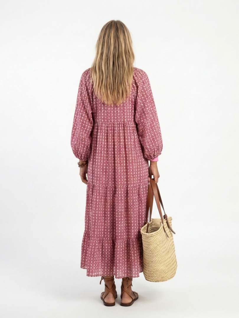Back view geometric print dusty rose long-sleeve midi dress with billowy sleeves