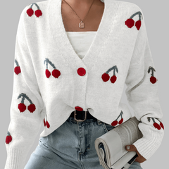 White long-sleeve cardigan with cherry print and red button front