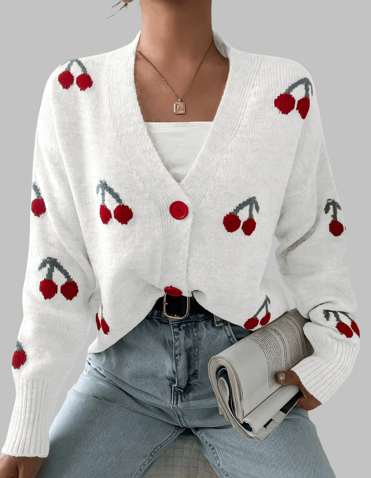 White long-sleeve cardigan with cherry print and red button front