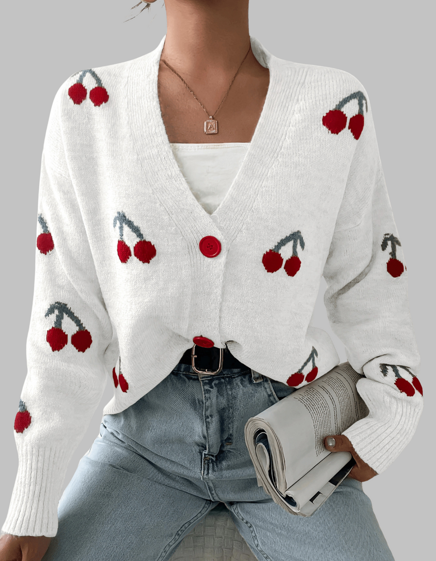 White long-sleeve cardigan with cherry print and red button front