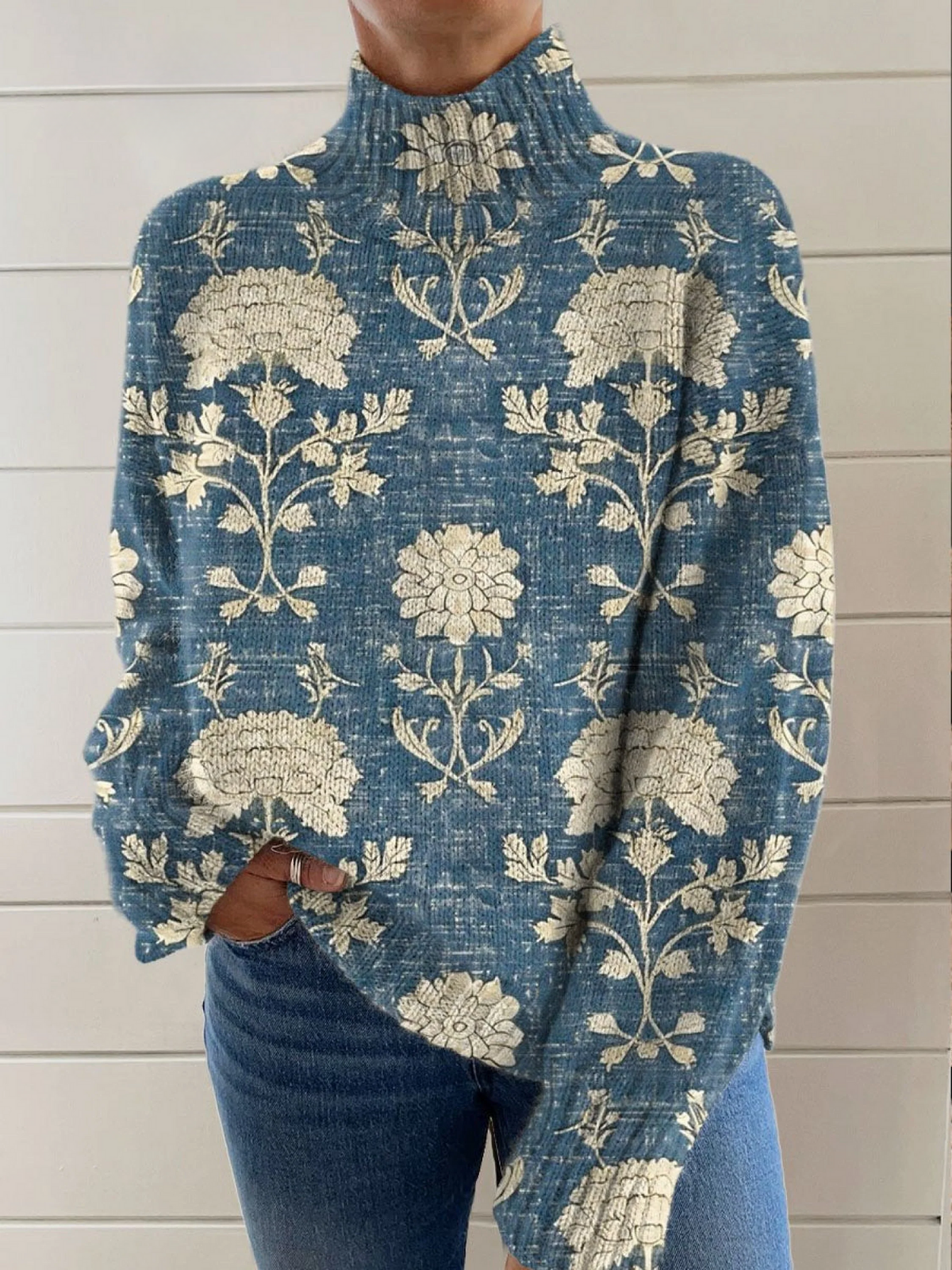 Blue floral turtleneck knit sweater with long sleeves and ribbed collar