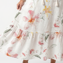 Tiered white midi skirt with large floral print and ruffled hem