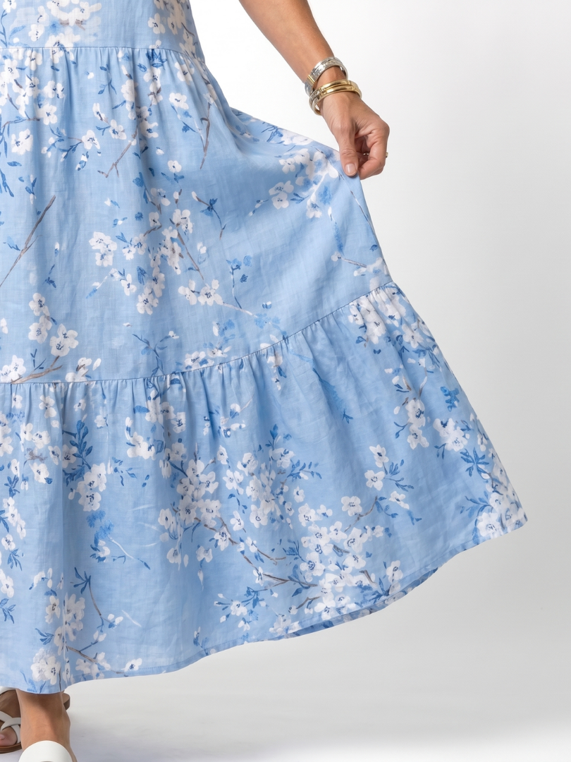 Blue floral midi dress close-up of tiered ruffle hem detail