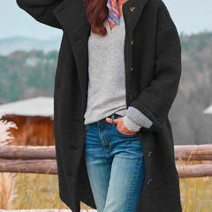 Black hooded long coat with button front and side flap accents