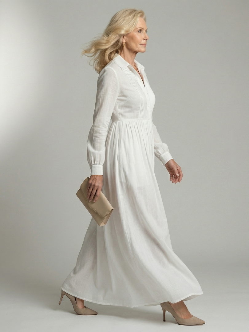 White soft flow maxi dress with long sleeves and button front, side view