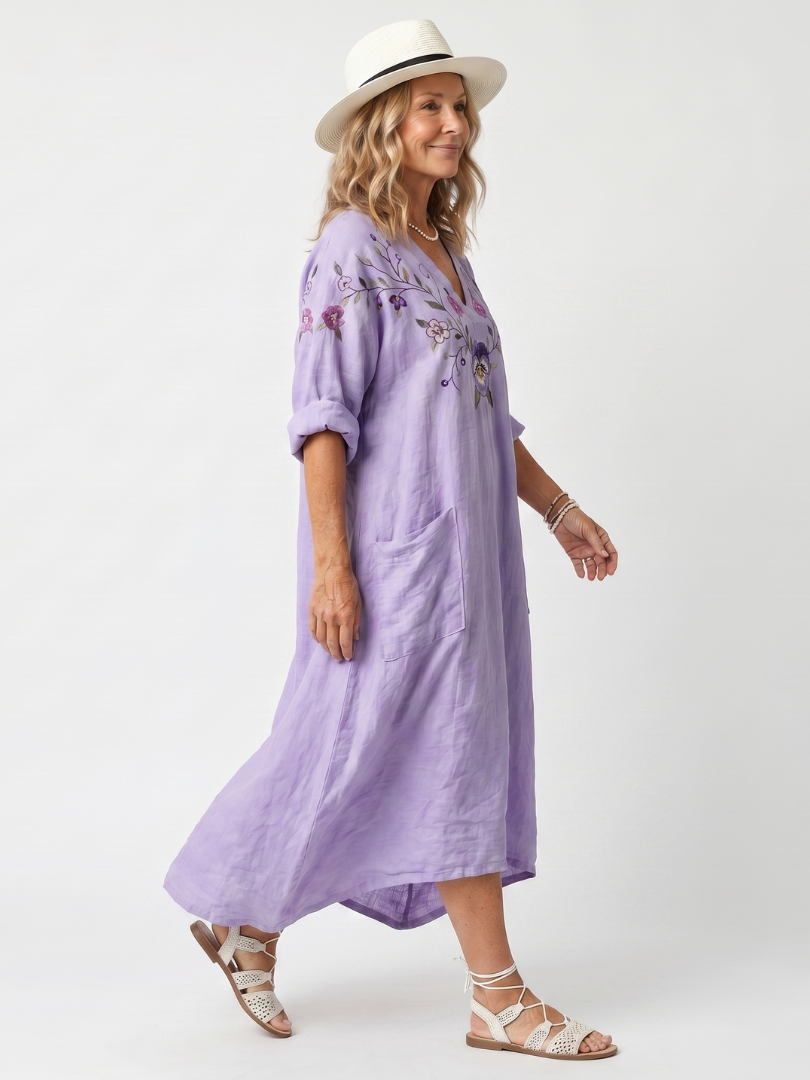 Purple floral pocket midi dress, side view, V-neck with embroidered details