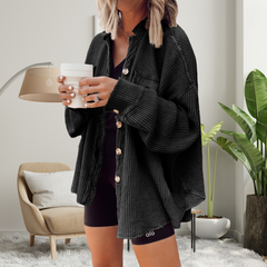 Cozy loose-fit batwing button-down jacket in black, textured knit, chest pockets