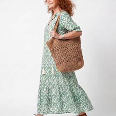 Green patterned V-neck tie midi dress, side view, short puff sleeves
