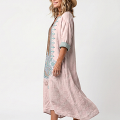 Pink relaxed midi dress profile with turquoise trim and 3/4 sleeves